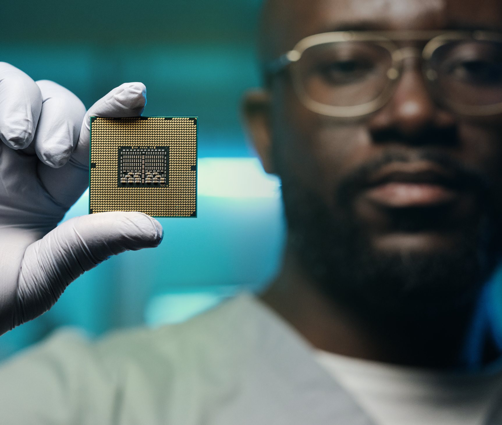 scientist holding a computer chip