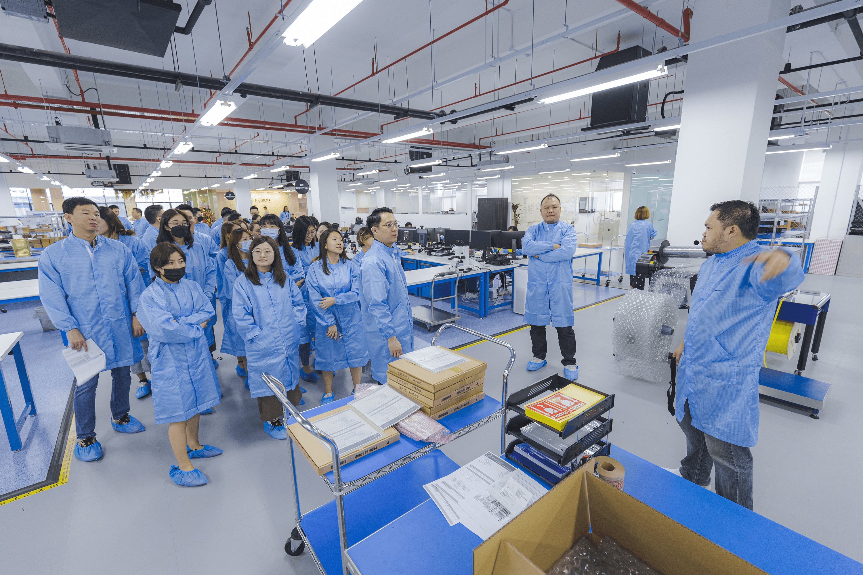 Group of Fusion Worldwide and Prosemi engineers in a quality testing facility